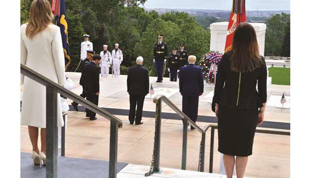 First Lady Melania Trump (left) stands with Second Lady Karen Pence as US President Donald Trump and Vice-President Mike Pence participate at the wreath laying ceremony at the Tomb of the Unknown Soldier at Arlington National Cemetery, Virginia.