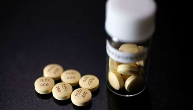 Tablets of Avigan (generic name : Favipiravir), a drug approved as an anti-influenza drug in Japan and developed by drug maker Toyama Chemical Co, a subsidiary of Fujifilm Holdings Co. are displayed during a photo opportunity at Fujifilm's headquarters in Tokyo October 22, 2014