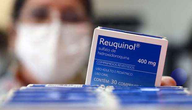 A health worker holds a box of hydroxychloroquine at the pharmacy of the Nossa Senhora da Conceicao hospital, amid the coronavirus disease outbreak in Porto Alegre, Brazil, May 26