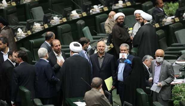 Iranian lawmakers attend the opening ceremony of Iran's 11th parliament, as the spread of the coronavirus disease continues, in Tehran, Iran