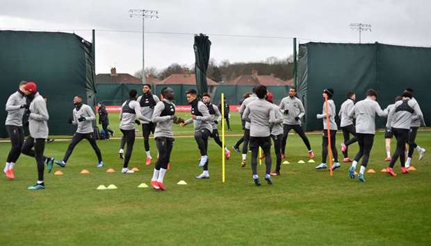 In this March 10, 2020, picture, Liverpool players attend a training session at Melwood in Liverpool, United Kingdom, on the eve of their UEFA Champions League last 16 second leg match against Atletico Madrid. (AFP)