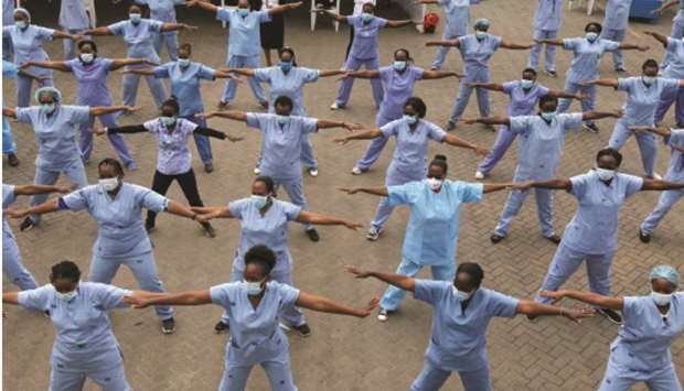 Nurses participate in a Zumba aerobic fitness programme as a way of helping them to cope with working situations at the Infectious Disease Unit grounds of the Kenyatta National Hospital in Nairobi.