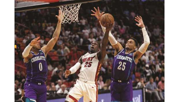 Miami Heat guard Kendrick Nunn (centre) in action against the Charlotte Hornets during a regular NBA game at the AmericanAirlines Arena in Miami on March 11, 2020. (TNS)