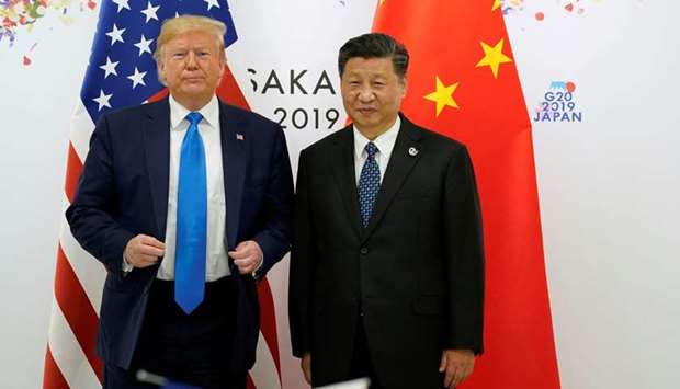 FILE PHOTO: US President Donald Trump and Chinau2019s President Xi Jinping pose for a photo ahead of their bilateral meeting during the G20 leaders summit in Osaka, Japan, June 29, 2019.