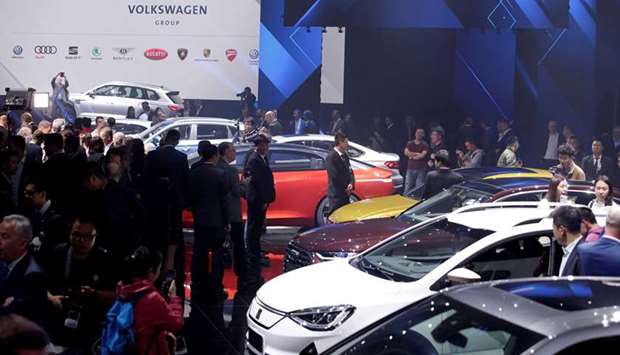 New cars are displayed at a Volkswagen media event ahead of the Beijing Auto Show in Beijing (file). The German car giant said it will take a 50% stake in JAG u2013 the parent company of Chinau2019s state-owned JAC Motors u2013 and increase its holding in the JAC Volkswagen joint venture from 50% to 75% for around u20ac1bn.