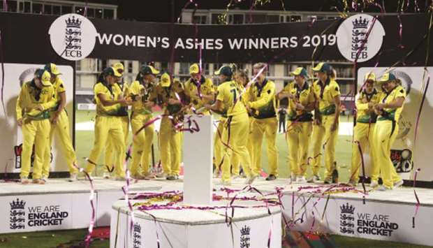 Australian players celebrate after winning the Womenu2019s Ashes series against England in Bristol, Britain, on July 31, 2019. (Reuters)