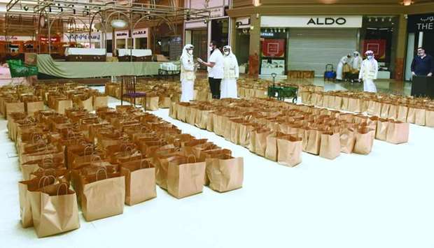 In co-operation with Qatar Charity, the charitable community initiative 'Laka Al Ajr' (You deserve the reward) has distributed 7,500 meals among needy individuals and families from across the country since the start of the holy month of Ramadan, with the participation of about 40 volunteers, including Qataris and expatriates. Ahmed al-Qahtani, a spokesman for the initiative, said all precautionary measures are taken in the preparation of the food and distribution of the kits in view of the coronavirus pandemic. He also pointed out that all the distributed meals are homemade. Pictured are volunteers taking part in the initiative at Hyatt Plaza Mall. PICTURE: Shemeer Rasheed
