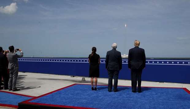 US President Donald Trump, with Vice President Mike Pence and his wife Karen Pence, watches the launch of a SpaceX Falcon 9 rocket and Crew Dragon spacecraft, from Cape Canaveral, Florida