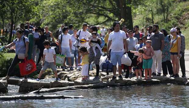 People enjoy hot weather yesterday in Dovedale, a valley in the Peak district of England.
