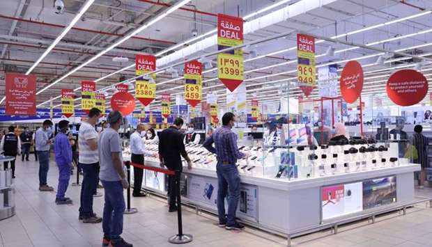 Customers queue at Carrefour's electronics section to buy smartphones during Eid.