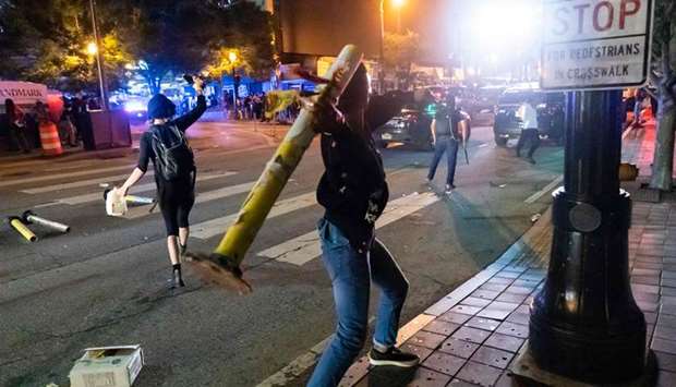 Protesters face off with police during rioting and protests in Atlanta on Friday night.