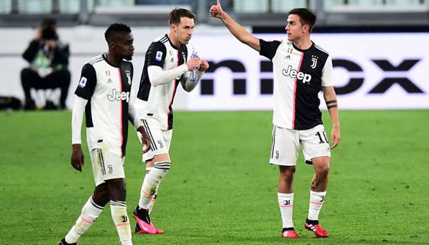 In this March 8, 2020, picture, Juventusu2019 Paulo Dybala (right) celebrates scoring their second goal during the Serie A match against Inter Milan in Turin, Italy. (Reuters)