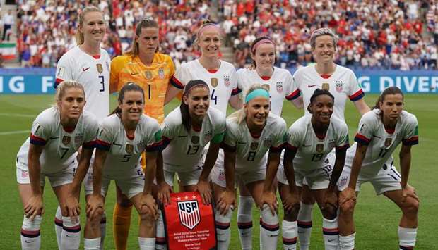 In this June 28, 2019, picture, US players pose ahead of the France 2019 Womenu2019s World Cup quarter-final against France at the Parc des Princes stadium in Paris, France. (AFP)