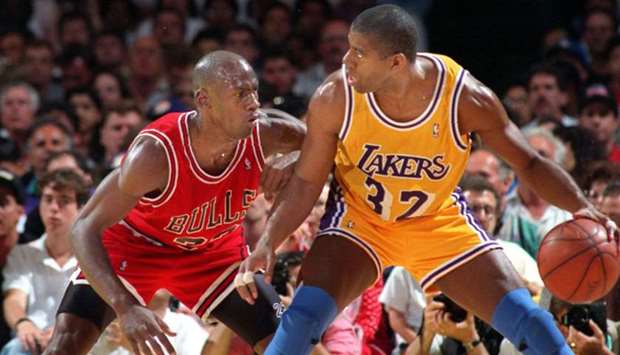Los Angeles Lakersu2019 Magic Johnson (right) tries to drive past Chicago Bullsu2019 Michael Jordan during the 1991 NBA finals. (TNS)