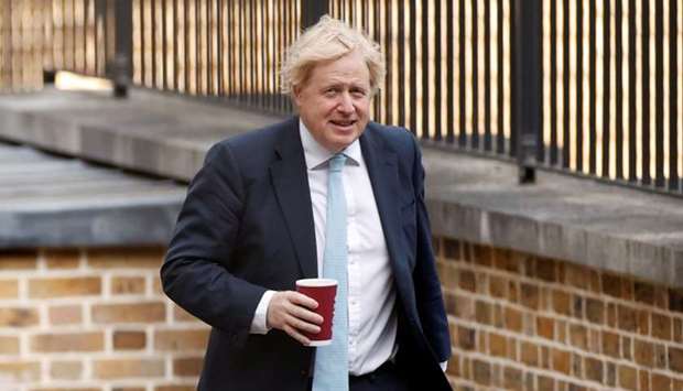Britain's Prime Minister Boris Johnson arrives at Downing Street, following the outbreak of the coronavirus disease in Londo
