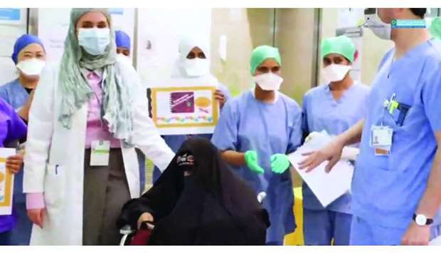 HMC's Dr Muna al-Maslamani, Dr Muna al-Rashid and Dr Mohamed Abu Khattab were among the group of doctors, and nurses who gathered to say goodbye to ,this very special patient,.