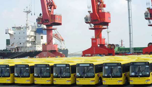 Buses wait to be exported in Lianyungang port. Chinau2019s overseas shipments in April rose 3.5% from a year earlier, marking the first positive growth since December last year, customs data showed yesterday.