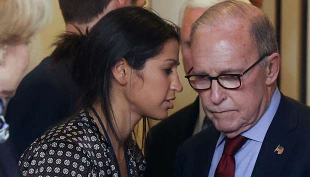 Katie Miller, press secretary for US ?Vice President Mike Pence?, speaks to White House chief economic adviser Larry Kudlow before the daily coronavirus task force briefing at the White House in Washington on March 10