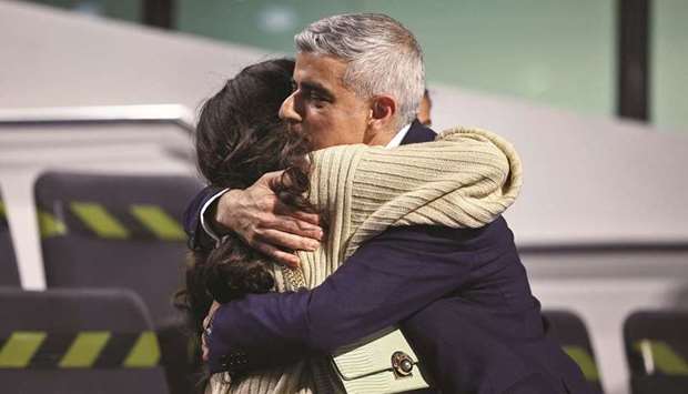 Mayor of London Sadiq Khan embraces a family member following a speech after being re-elected in the London mayoral election, at the City Hall in London. (Reuters)