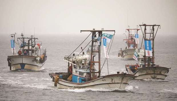 South Korean fishing boats take part in a marine protest, part of nationwide protests to demand Japan withdraw its decision to release contaminated water from its crippled Fukushima nuclear plant into the sea, at the sea off Incheon, yesterday.