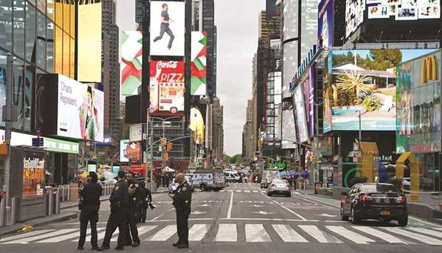 Police officers are seen in New York Cityu2019s Times Square following reports of three people, including a toddler, being shot.