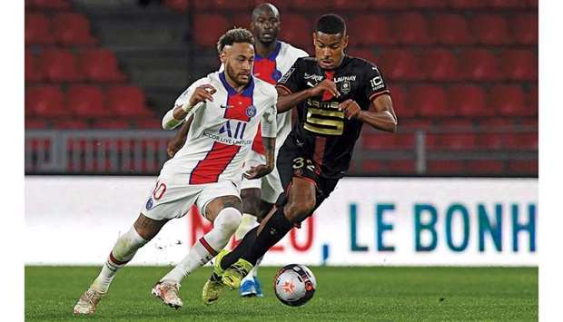 Paris Saint-Germainu2019s Brazilian forward Neymar (left) is challenged by Rennesu2019 French midfielder Andy Diouf during the French Ligue match at the Roazhon Park stadium in Rennes, northwestern France on Sunday. (AFP)