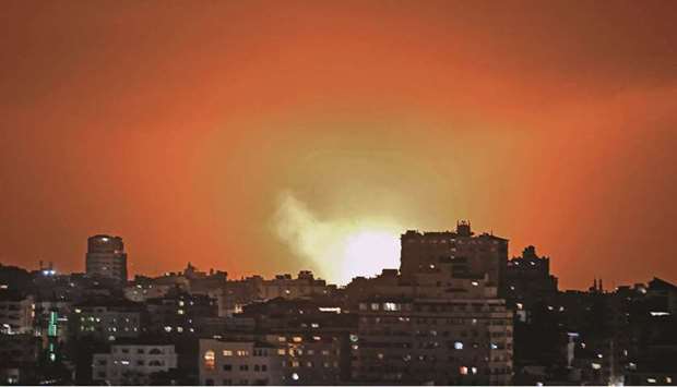 Fire billows from an Israeli air strike in the Gaza Strip