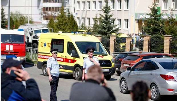 Law enforcement officers and ambulances are seen at the scene of a shooting at School No. 175 in Kazan, the capital of Russia's republic of Tatarstan. AFP