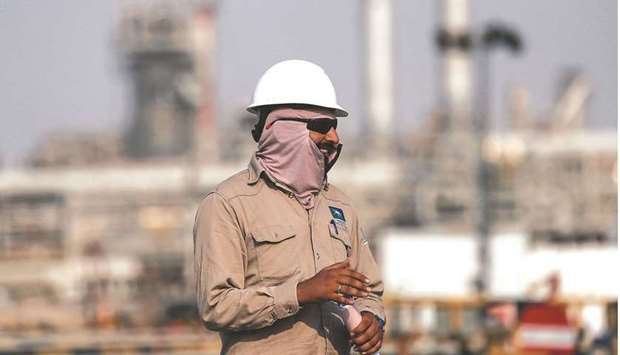 An employee looks on at the Saudi Aramco oil facility in Abqaiq (file). Indian state refiners requested regular supplies from the Saudi state energy giant for June, after reducing purchases this month.