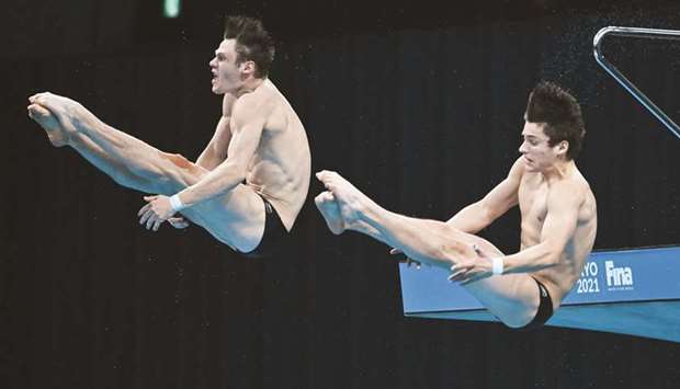 Vincent Riendeau and Nathan Zsombor-Murray of Canada compete during the menu2019s synchronised 10m platform at the FINA Diving World Cup at the Tokyo Aquatics Centre yesterday.