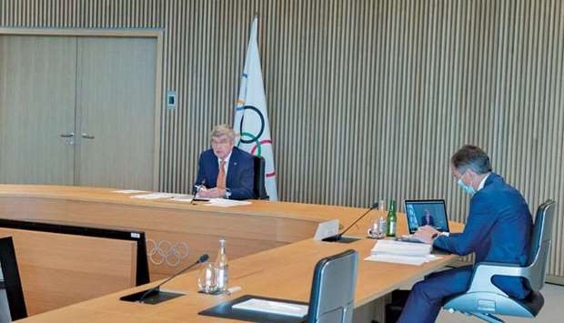 International Olympic Committee (IOC) President Thomas Bach (left) opens the Executive Board virtual meeting at the Olympic house in Lausanne, Switzerland, yesterday. (Reuters)