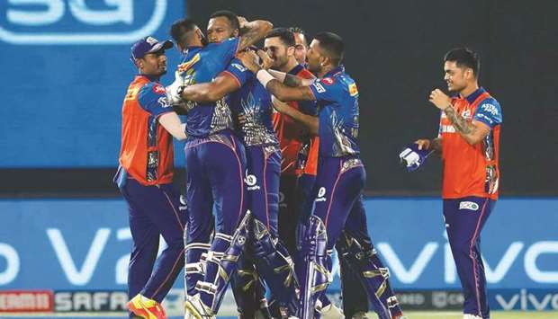Kieron Pollard (centre) of Mumbai Indians celebrates their victory over Chennai Super Kings with his teammates yesterday. (IPL)
