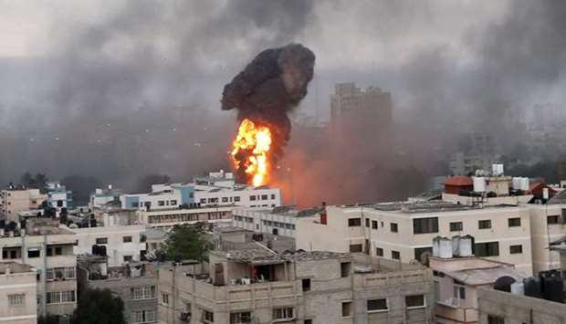 Smoke and flames rise during Israeli air strikes amid a flare-up of Israeli-Palestinian violence, in Gaza. REUTERS