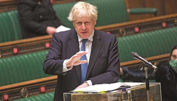 A handout photograph released by the UK Parliament shows Britainu2019s Prime Minister Boris Johnson updating MPs on the Covid-19 pandemic in a socially distanced, hybrid session at the House of Commons, in central London, on Wednesday.