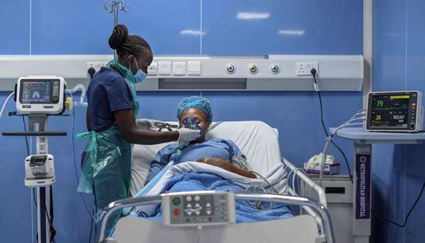 Critical care nurse fits a ventilator mask during a simulation to demonstrate delivery of medical oxygen to the Intensive Care Unit (ICU) following the installation of a modern Oxygen plant at the Metropolitan Hospital in Kenya's capital Nairobi
