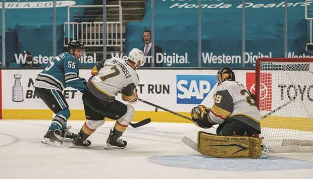 Vegas Golden Knights defenseman Alex Pietrangelo (centre) deflects the shot on goal by San Jose Sharks center Alexander Chmelevski (left) as goaltender Marc-Andre Fleury looks on during the third period of their NHL game at SAP Center at San Jose. (USA TODAY Sports)