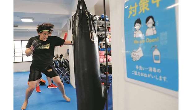 Arisa Tsubata, 27, a nurse and a boxer, trains at a gym inside a psychiatric clinic where she works in Tokyo.