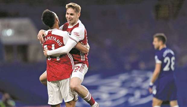 Arsenalu2019s Emile Smith Rowe (right) celebrates with Pierre-Emerick Aubameyang after scoring against Chelsea in the Premier League in London. (AFP)