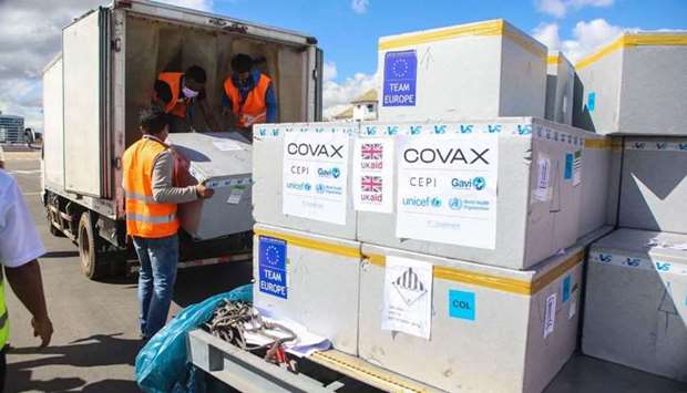 Workers load boxes of Oxford/AstraZeneca Covid-19 vaccines, part of the the Covax programme, which aims to ensure equitable access to Covid-19 vaccinations, into a truck after they arrived by plane at the Ivato International Airport in Antananarivo, Madagascar, on May 8