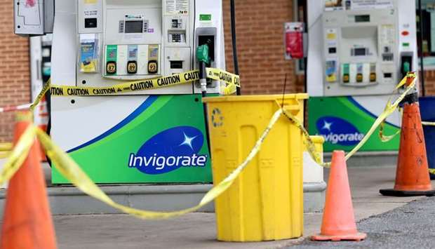 Gas pumps are roped off with a tape indicating a lack of gasoline at a gas station in Washington, US on May 14, 2021. (REUTERS)
