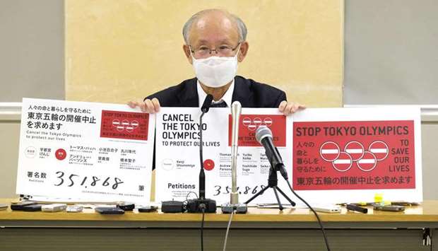 Kenji Utsunomiya, a Japanese lawyer and former Tokyo gubernatorial candidate, holds a press conference on his campaign Stop Tokyo Olympic after handing the petitions to the Tokyo Metropolitan Government in Tokyo