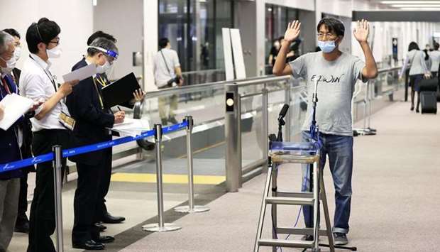 Japanese journalist Yuki Kitazumi who was detained in Myanmar and charged with spreading false news during a crackdown on media after a military coup in February, speaks to media upon his arrival at Narita Airport in Narita, Chiba prefecture, Japan on Friday. (REUTERS)