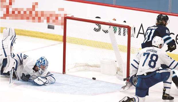 Winnipeg Jets left wing Kyle Connor (second right) scores on Toronto Maple Leafs goaltender Jack Campbell in the second period at Bell MTS Place in Winnipeg. (USA TODAY Sports)