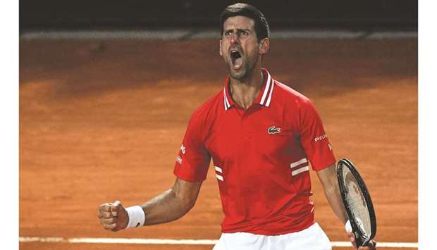 Serbiau2019s Novak Djokovic celebrates a point during the Italian Open semi-final against Italyu2019s Lorenzo Sonego (not pictured) at Foro Italico in Rome, Italy, yesterday. (AFP)