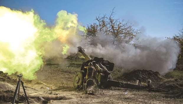 In this file photo taken on October 25, 2020, an Armenian soldier fires artillery on the front line during the ongoing fighting between Armenian and Azerbaijani forces over the region of Nagorno-Karabakh.