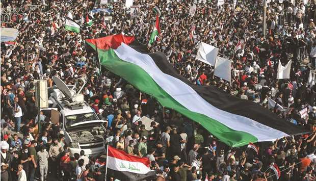 Iraqis gather in the capital Baghdadu2019s Tahrir square for a solidarity march with the Palestinians, yesterday, on the 73rd anniversary of the Nakba.