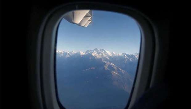 (File photo) Mount Everest, the world highest peak, and other peaks of the Himalayan range are seen through an aircraft window during a mountain flight from Kathmandu, Nepal, recently. (REUTERS)