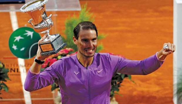 Spainu2019s Rafael Nadal celebrates with the trophy after winning his Italian Open final against Serbiau2019s Novak Djokovic (not pictured) in Rome, Italy, yesterday. (Reuters)