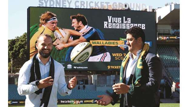 Former France star Fred Michalak (left) throws the ball towards Australiau2019s former rugby player Morgan Turinui after a press conference at the Sydney Cricket Ground. (AFP)