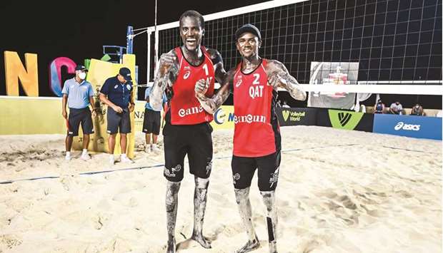 In this May 1, 2021, picture, Qataru2019s Cherif Younousse and Ahmed Tijan celebrate their win in the semi-final of the third tournament at the FIVB Beach Volleyball World Tour Cancun Hub. (FIVB)